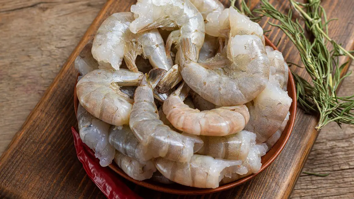 close up raw shrimps wooden background 123