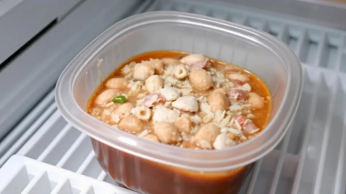 pikaso texttoimage A tupperware containing frozen pozole inside a fre 1