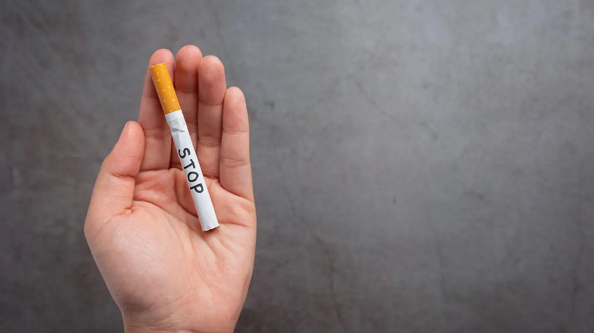 human hand holding cigarette world no tobacco day concept 123