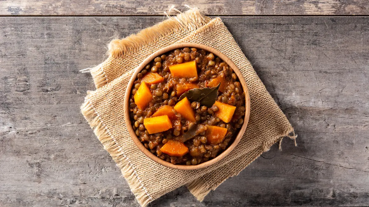 Lentil stew ragout with pumpkin and carrot in bowl