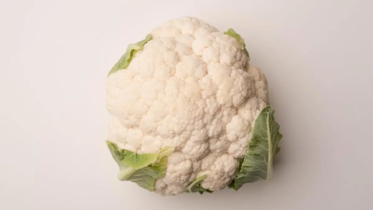 Close up of a ripe cauliflower isolated over white