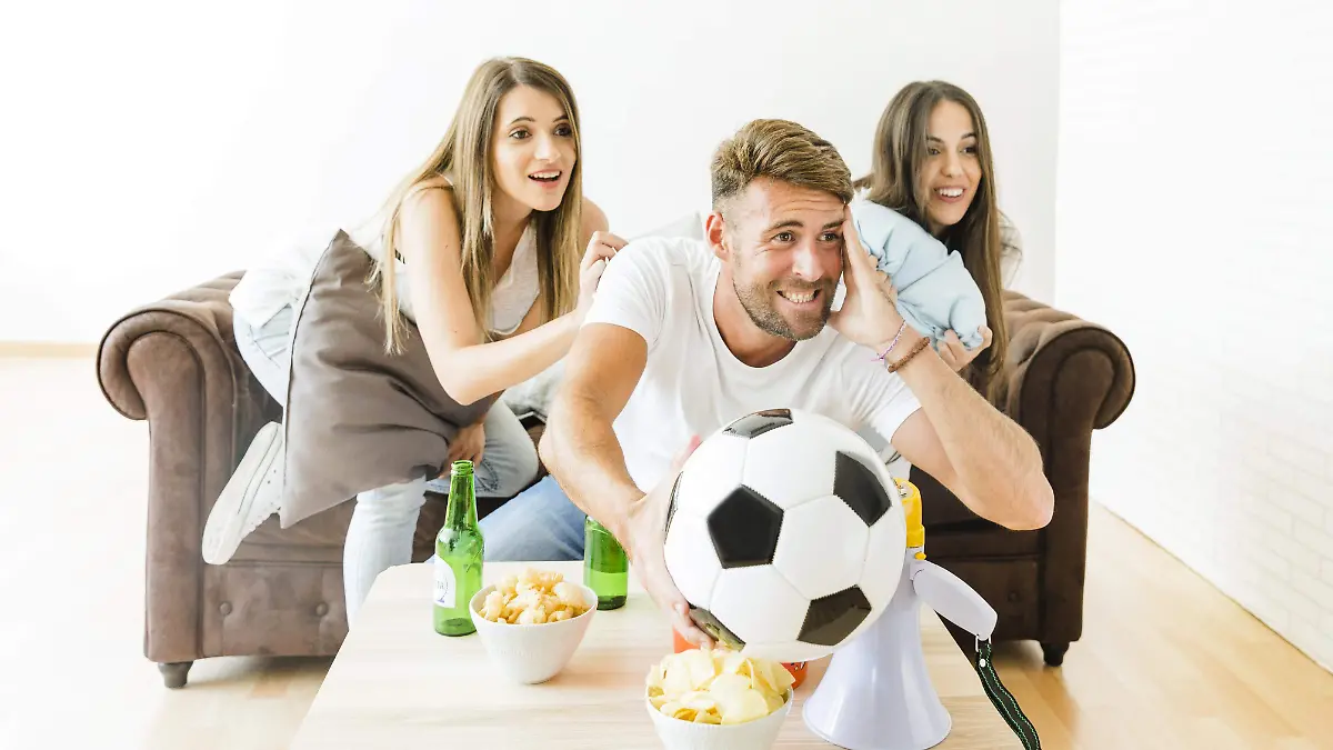 friends-cheering-football-team-home