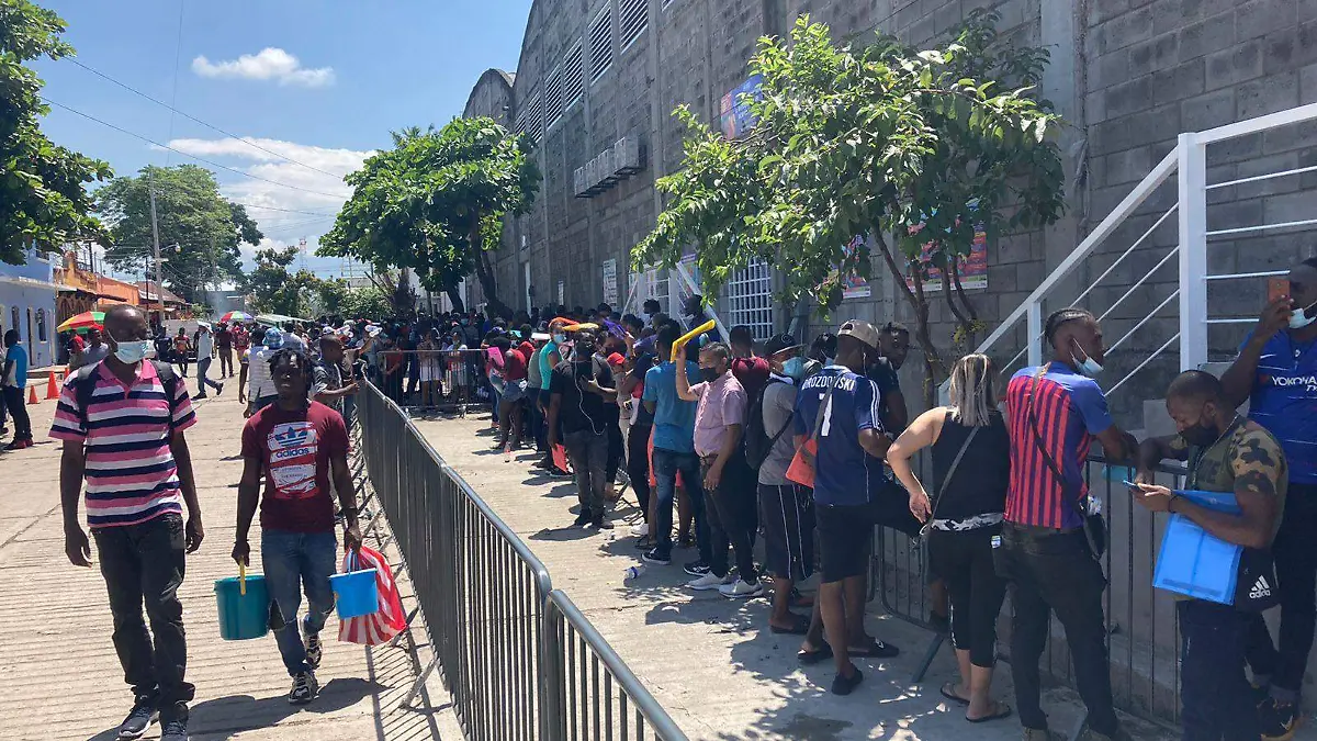 largas filas en comar