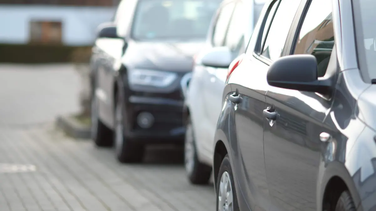 closeup-shot-of-black-car-in-the-parking-lot-with-blurred-background