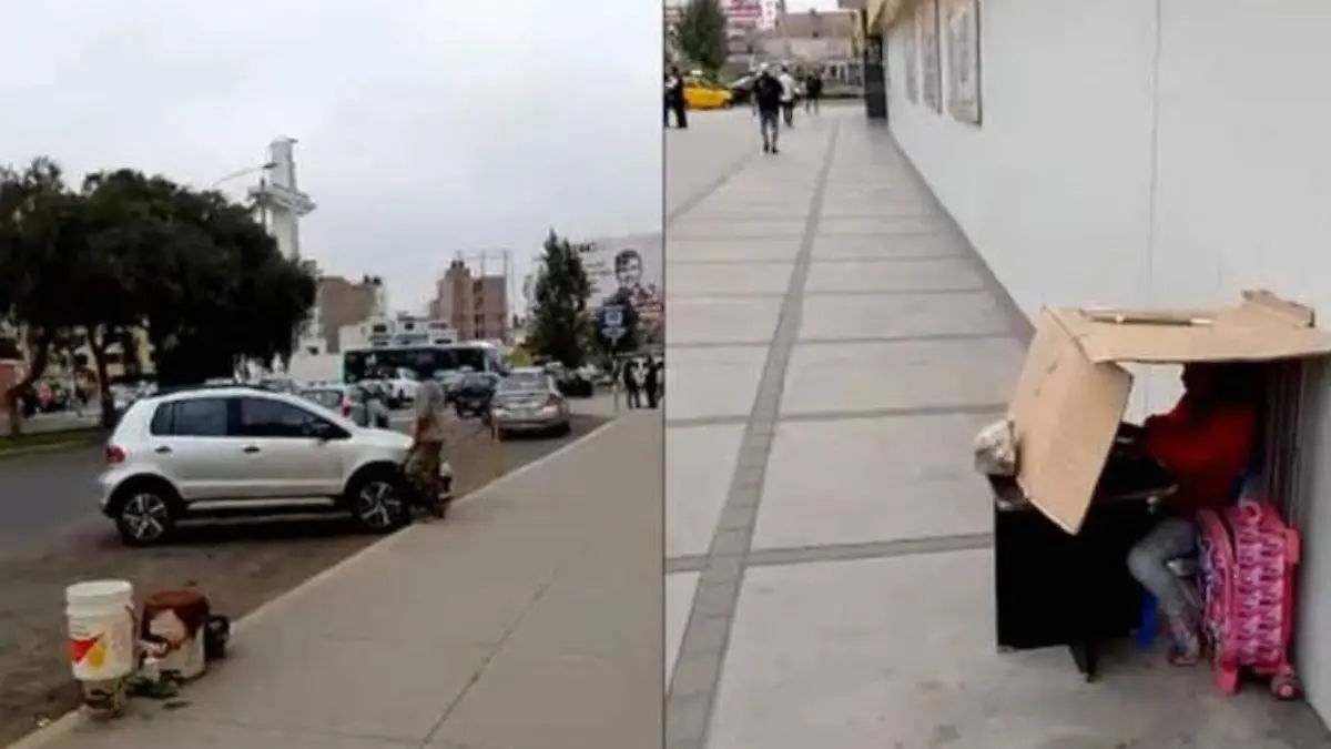 Niña estudia debajo de una caja de cartón mientras su papá lava coches