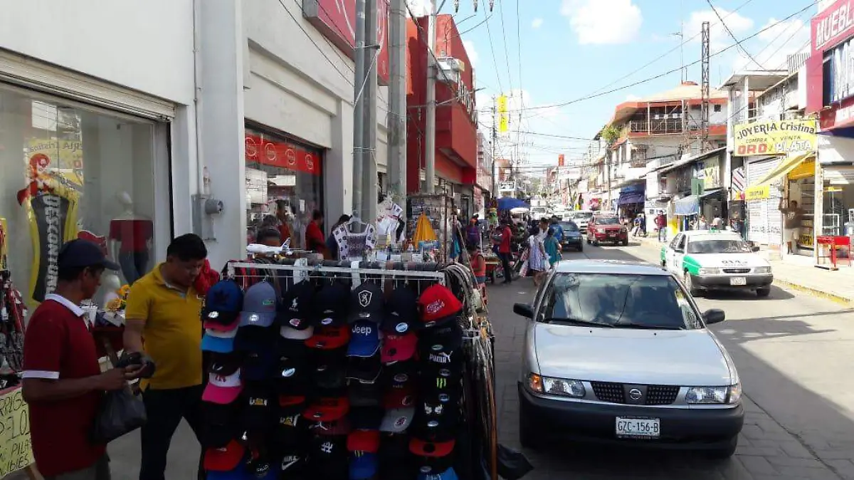 OME-Los-comerciantes-1