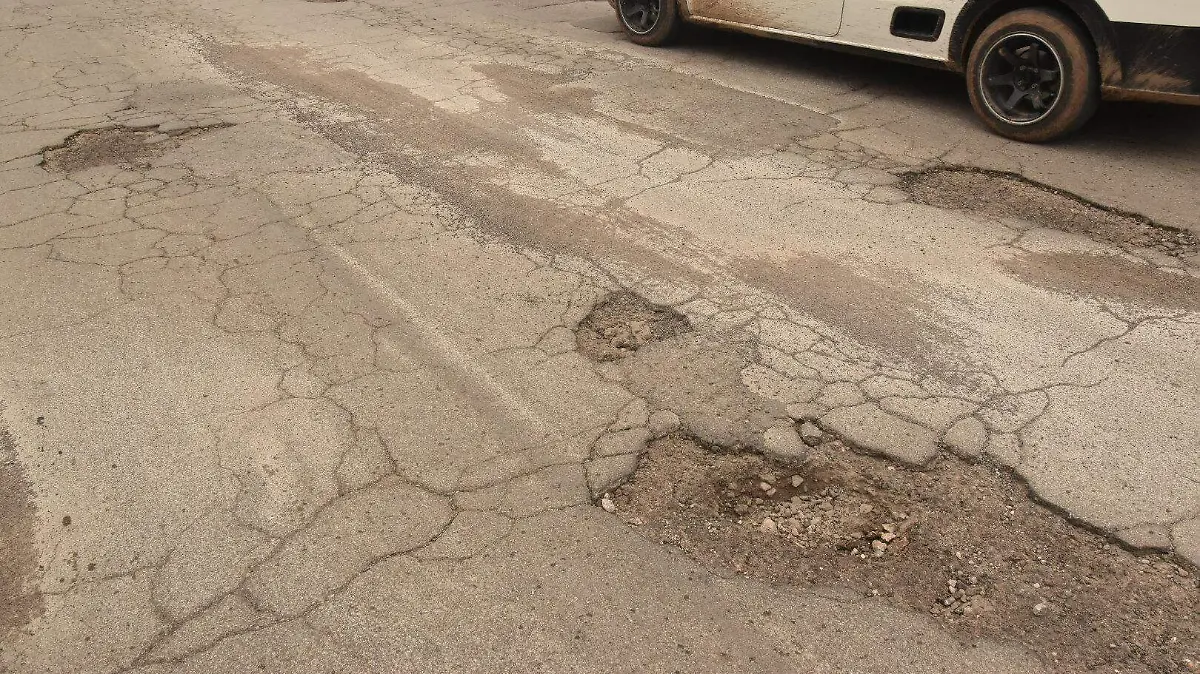 baches calle pavimento 
