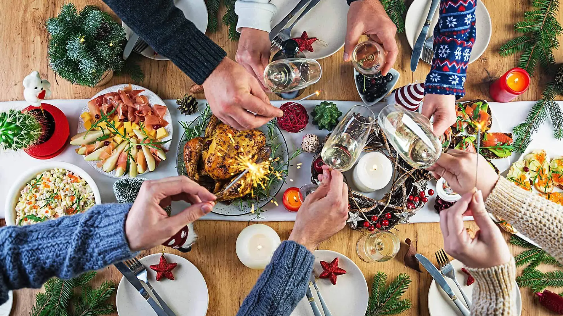 baked-turkey-christmas-dinner-the-christmas-table-is-served-with-turkey-decorated-with-bright-tinsel-and-candles-fried-chicken-table-family-dinner-top-view-hands-in-the-frame