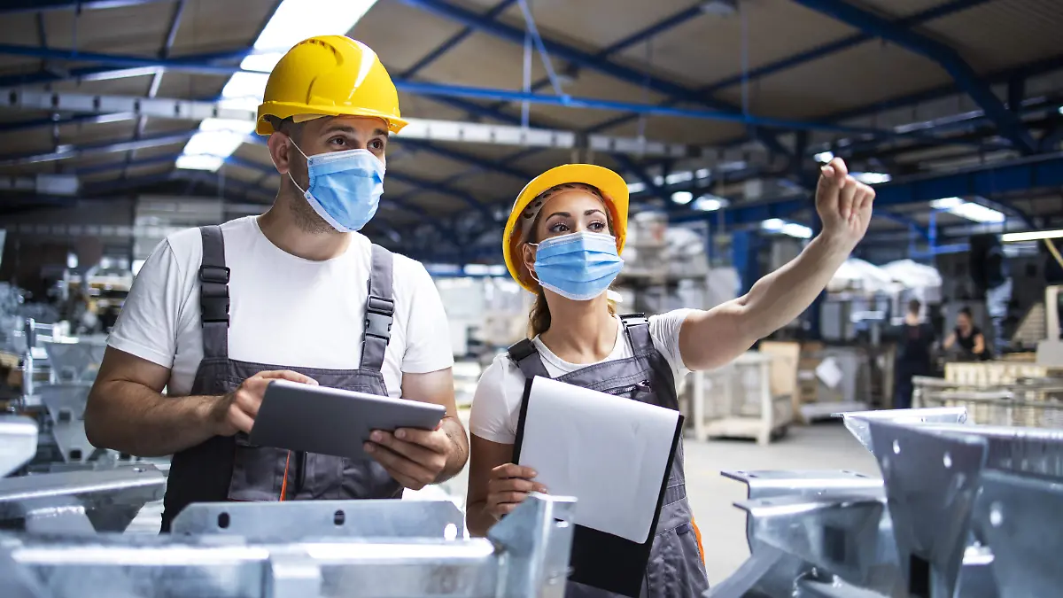 factory-workers-with-face-masks-protected-against-corona-virus-doing-quality-control-of-production-in-factory