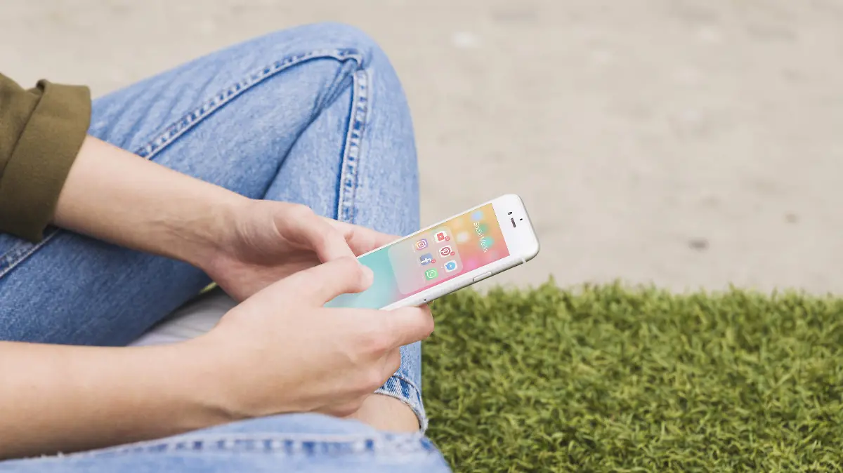 woman-s-hand-holding-cellphone-using-social-media-application