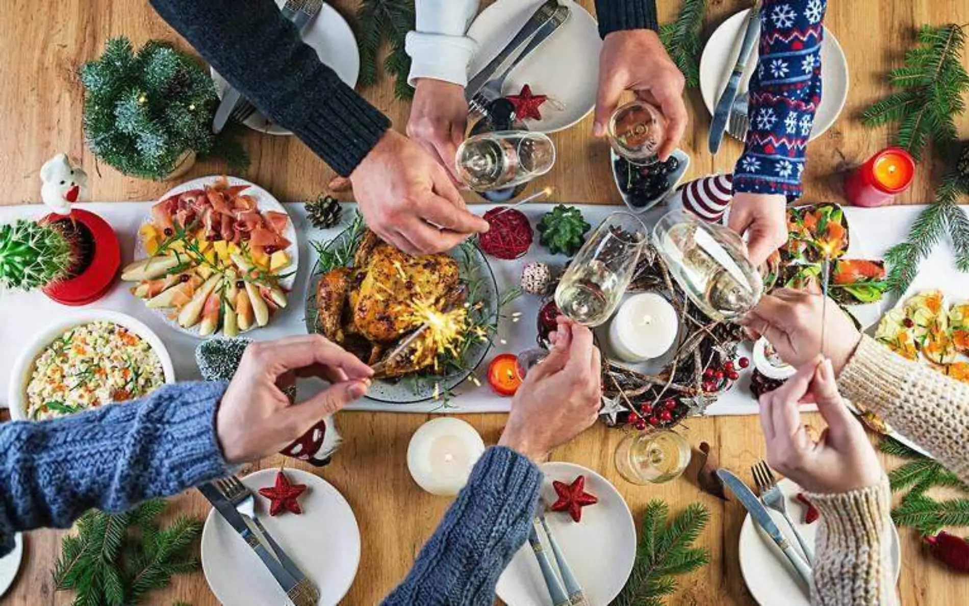 baked-turkey-christmas-dinner-the-christmas-table-is-served-with-turkey-decorated-with-bright-tinsel-and-candles-fried-chicken-table-family-dinner-top-view-hands-in-the-frame