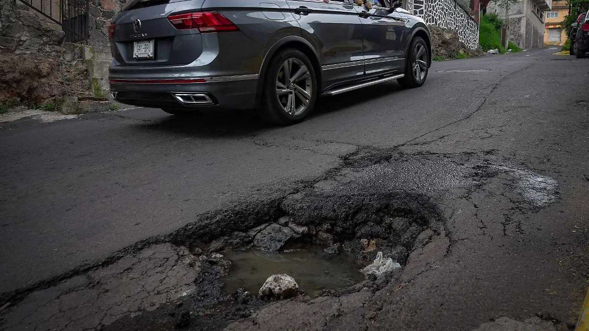 1039977_Baches y hundimientos lluvia_web