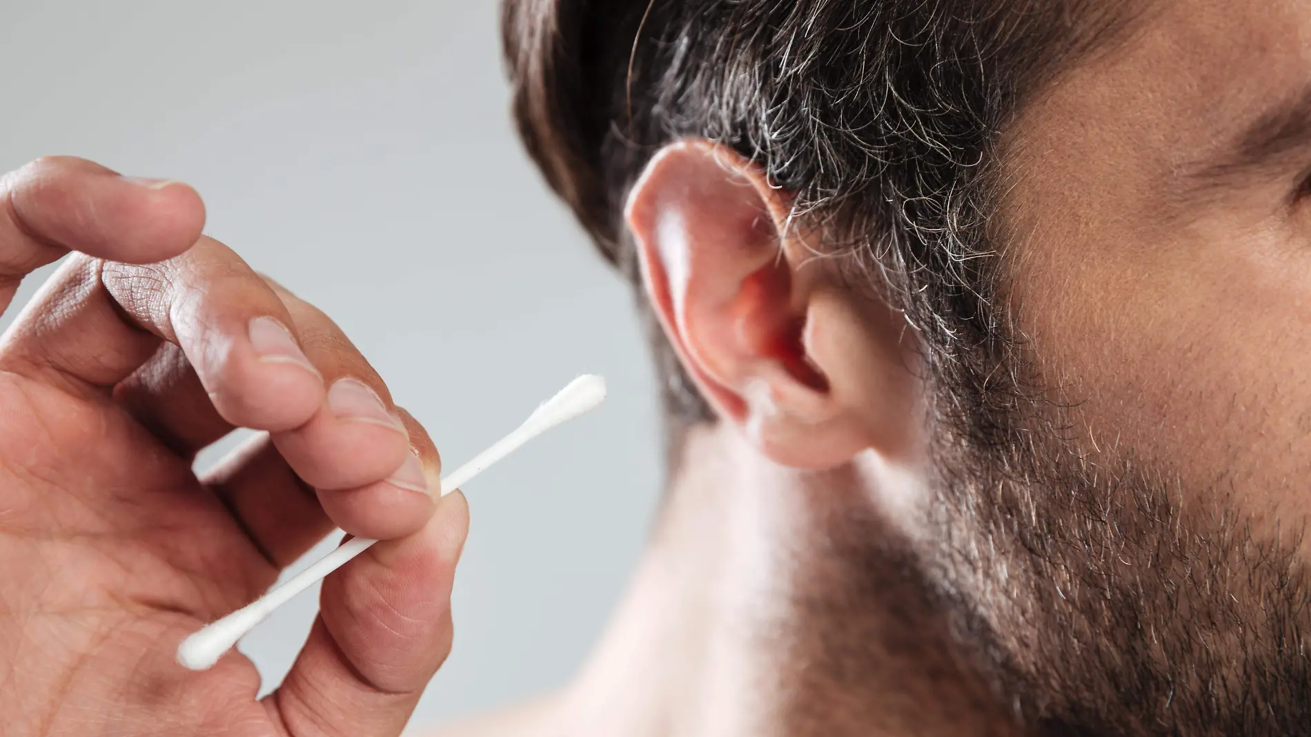 close-up-of-man-cleaning-his-ears