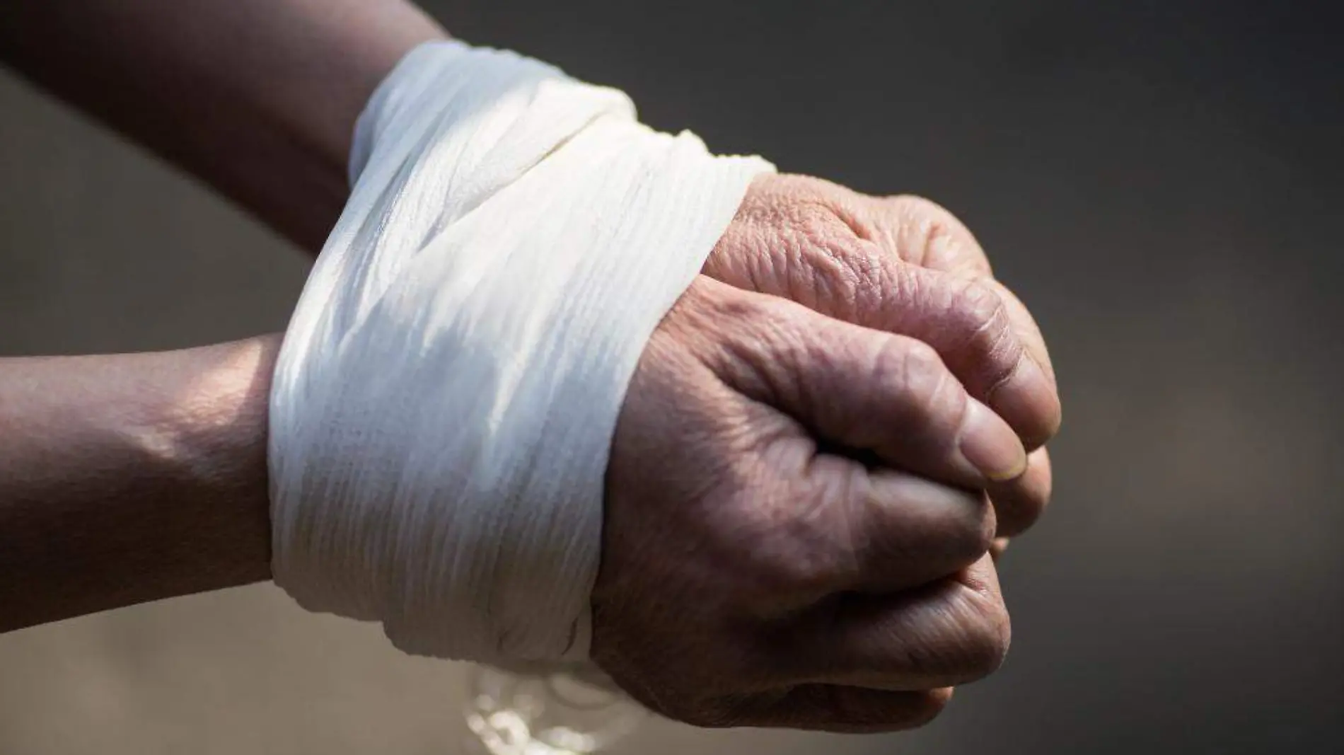 tied-up-hands-of-middle-aged-woman