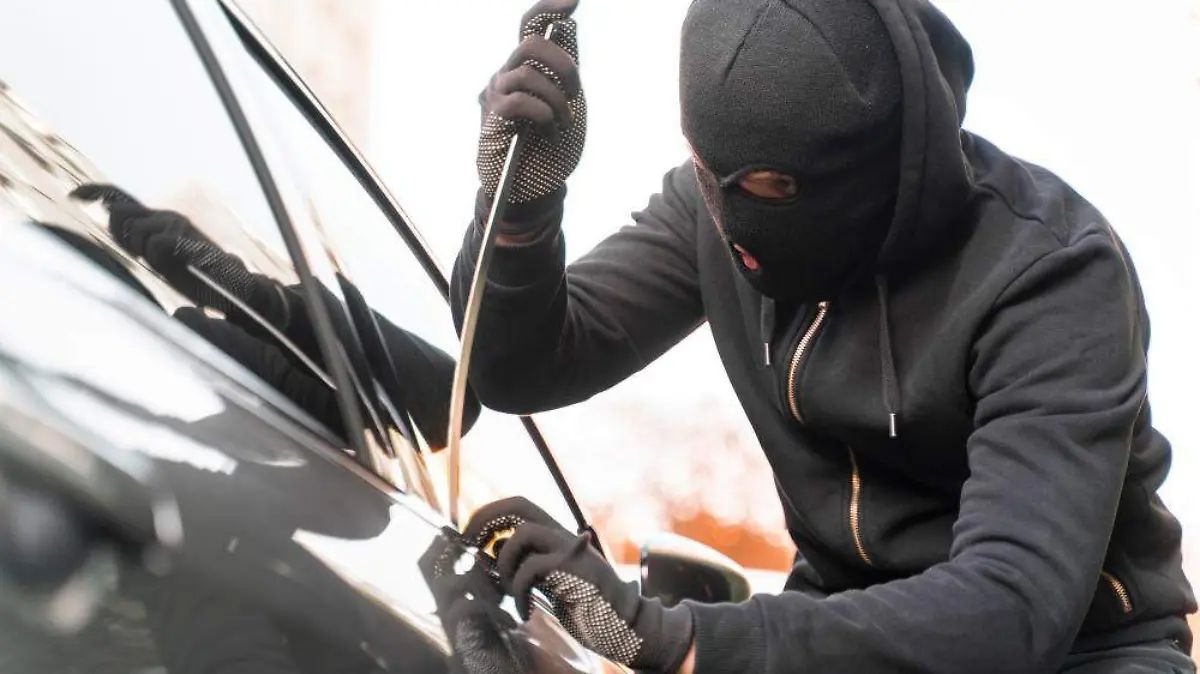 close-up-on-man-trying-to-break-into-car