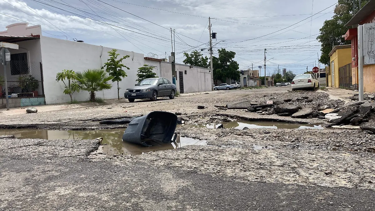 calle baches lluvia