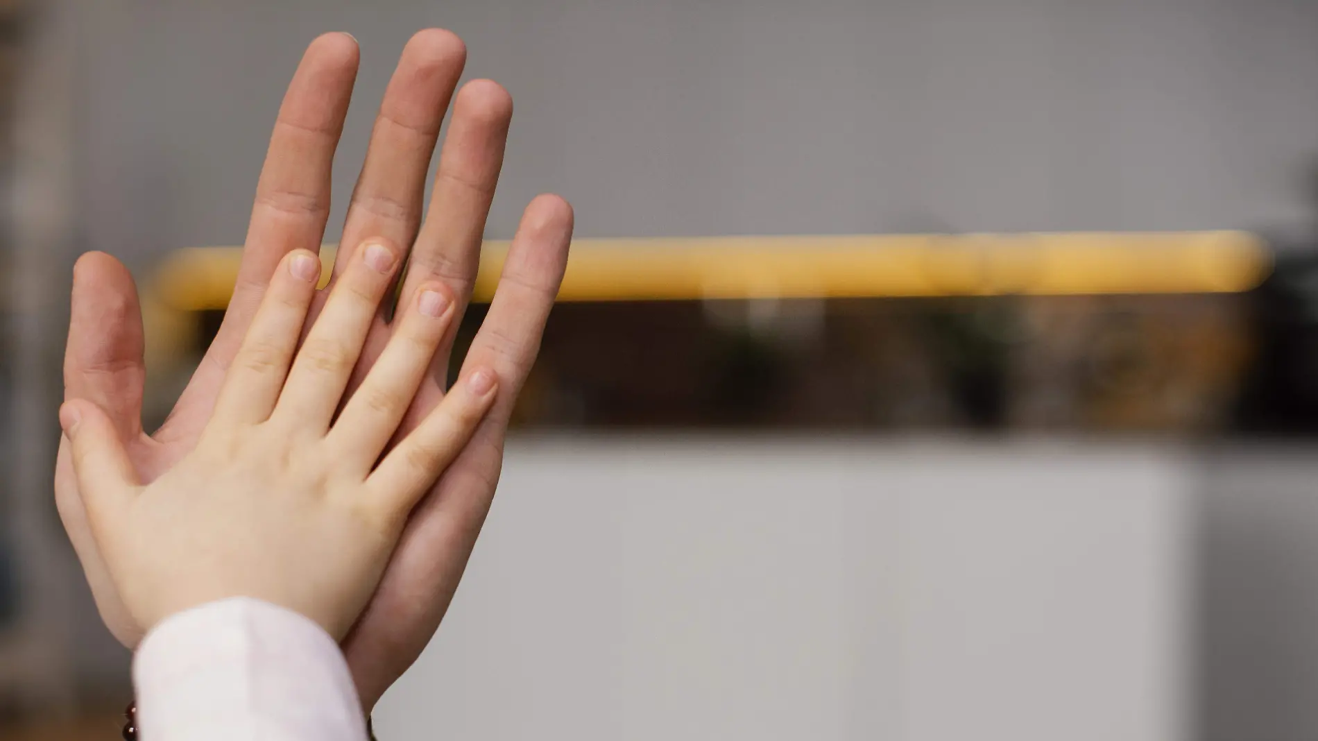 little-girl-comparing-hand-with-her-father-s