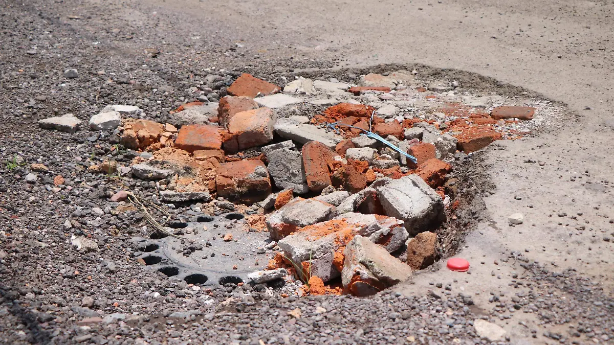 BACHES-CALLES-LLUVIAS