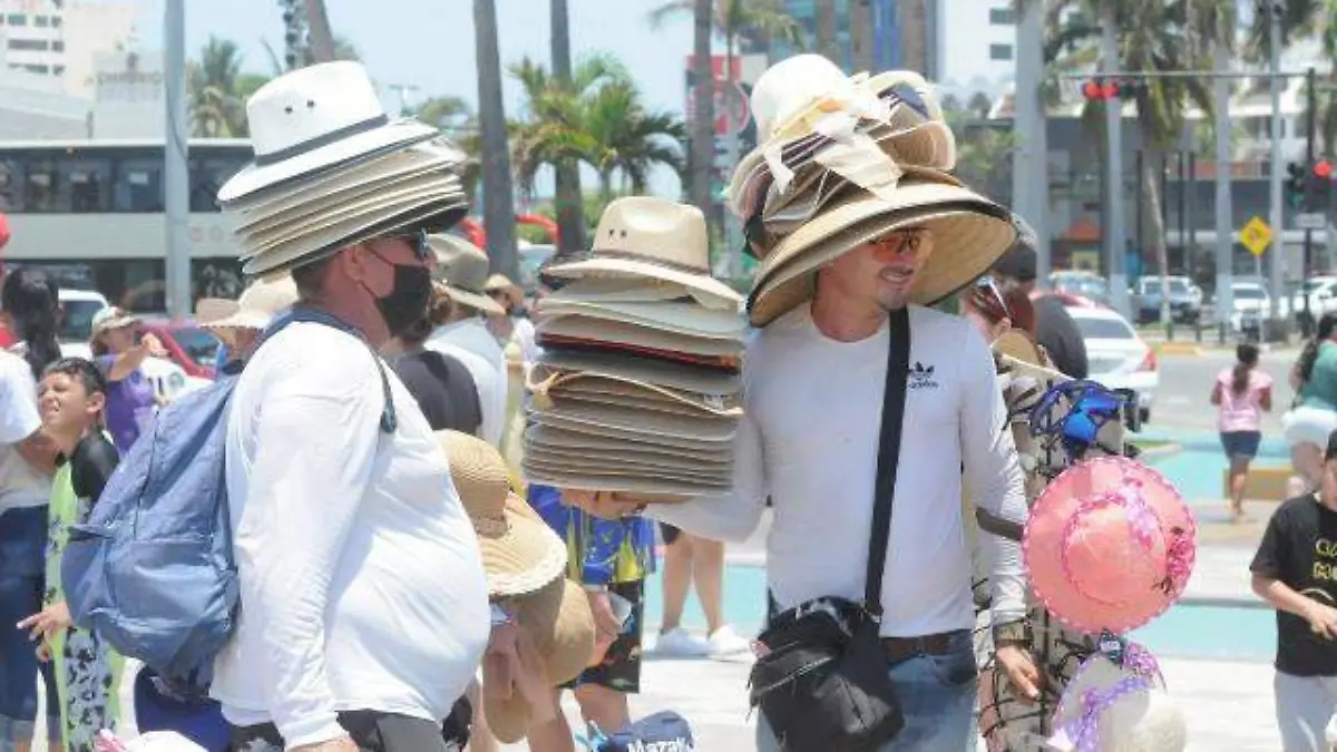vendedores - playa - sombreros