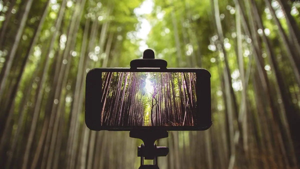 smartphone-on-selfie-stick-shallow-focus-photography-1629326