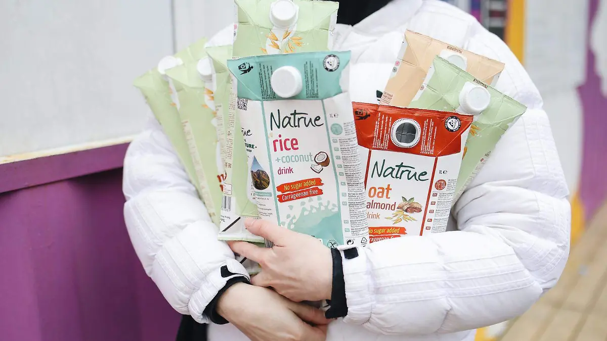 Canva - Person Holding Milk Carton