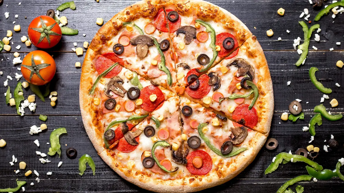 top-view-of-pepperoni-pizza-with-mushroom-sausages-bell-pepper-olive-and-corn-on-black-wooden (1)
