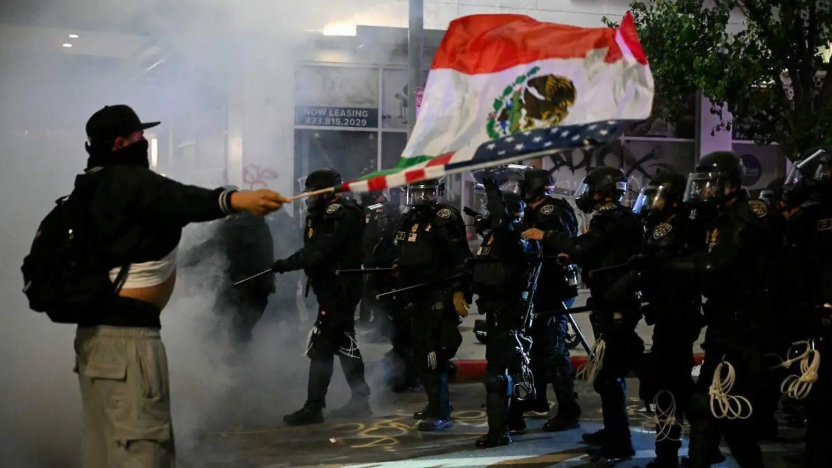 AFP__20250610__49QB7TH__v2__Preview__UsAgentsProtestersClashAgainInLosAngelesOverImm
