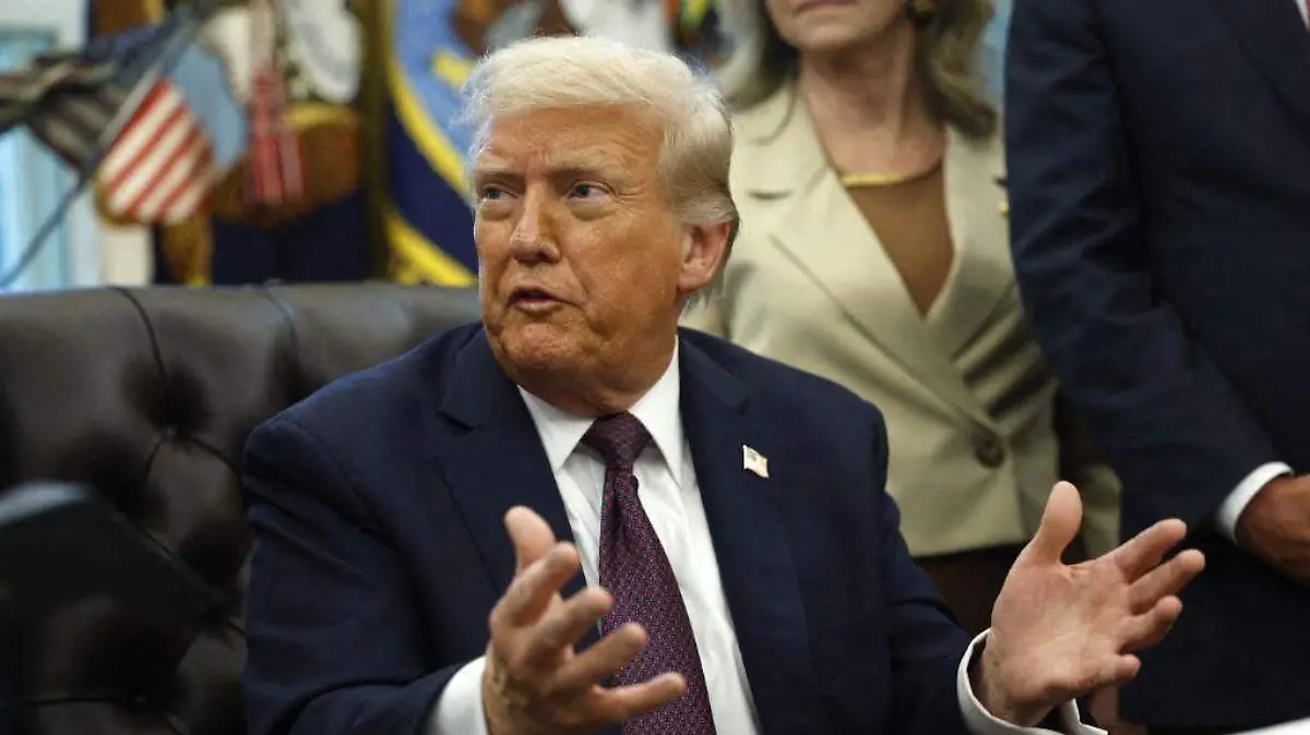 AFP__20250915__2235637207__v2__MidRes__DonaldTrumpSignsMemorandumInTheOvalOffice