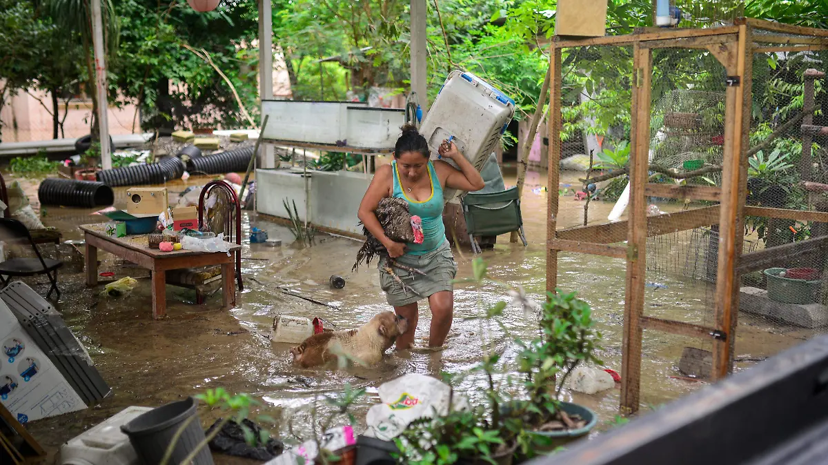 AFP__20251010__78EK2CR__v2__HighRes__MexicoFloodClimateWeather