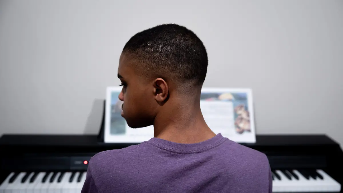 2026-06-26T215405Z_1574640325_MT1USATODAY29278692_RTRMADP_3_EMERY-WADE-16-SITS-AT-THE-KEYBOARD-DURING-HIS-PIANO-LESSON
