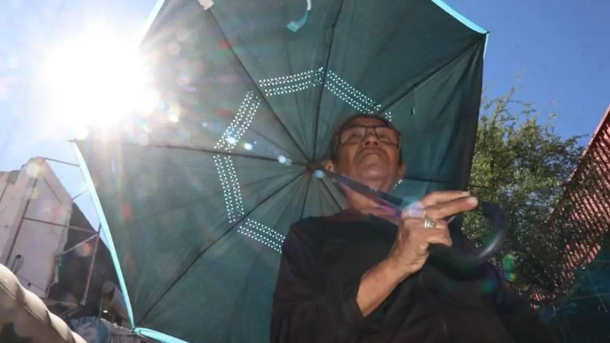 clima calor rayos uv sol sombrilla