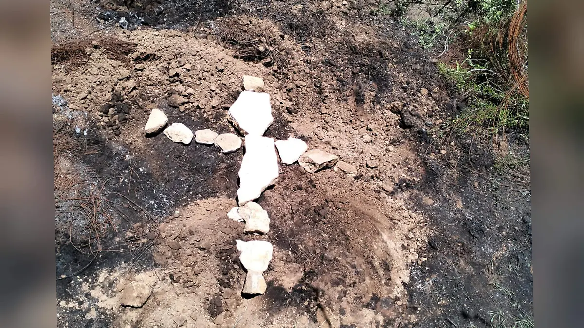 Cruz, lugar donde encontraron restos 