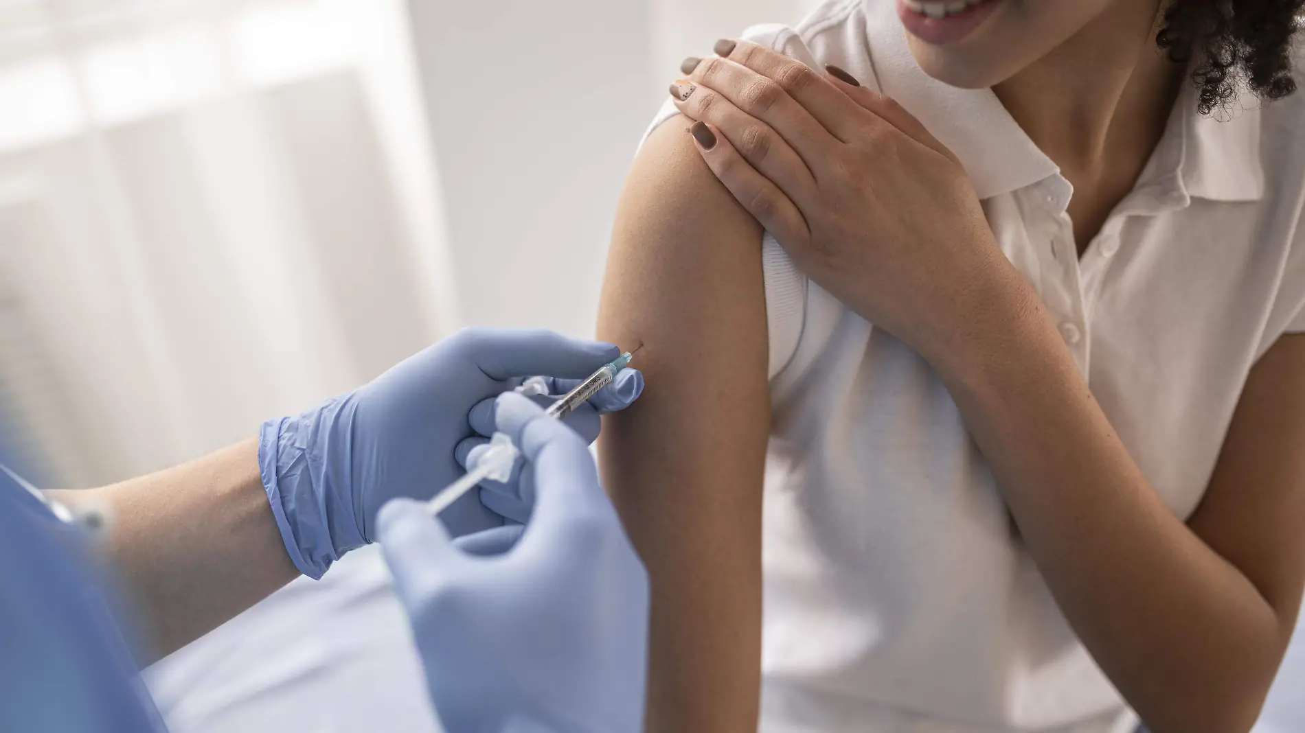 doctor-vaccinating-patient-in-clinic