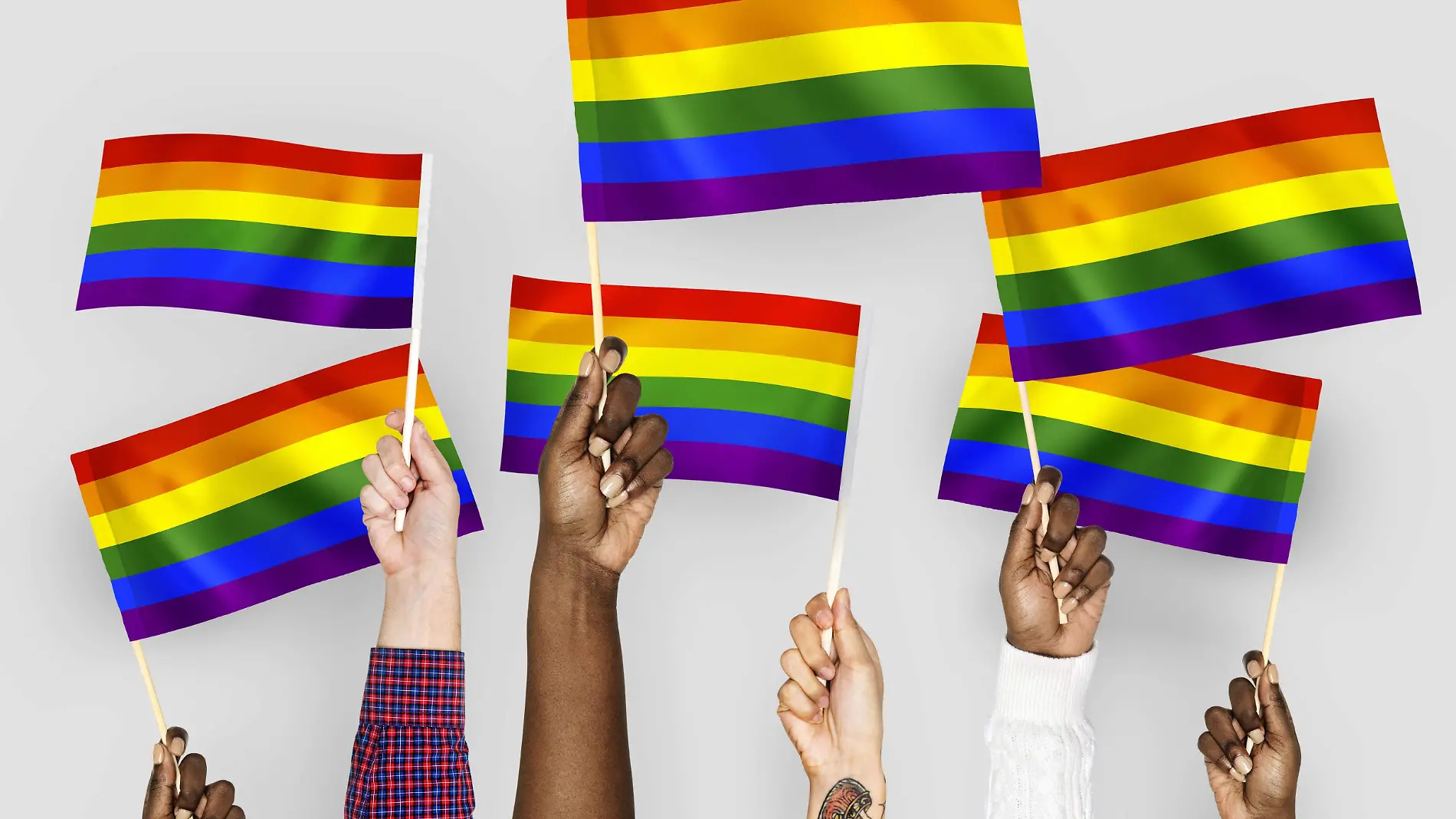 hands-waving-rainbow-flags