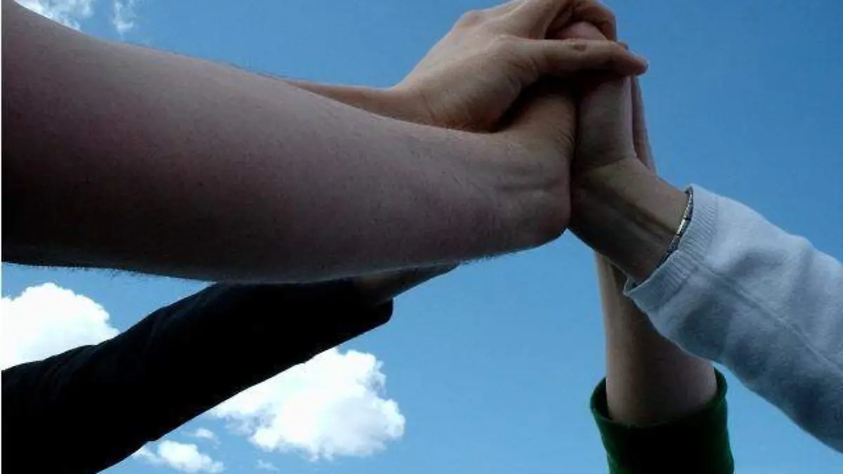 Team_touching_hands