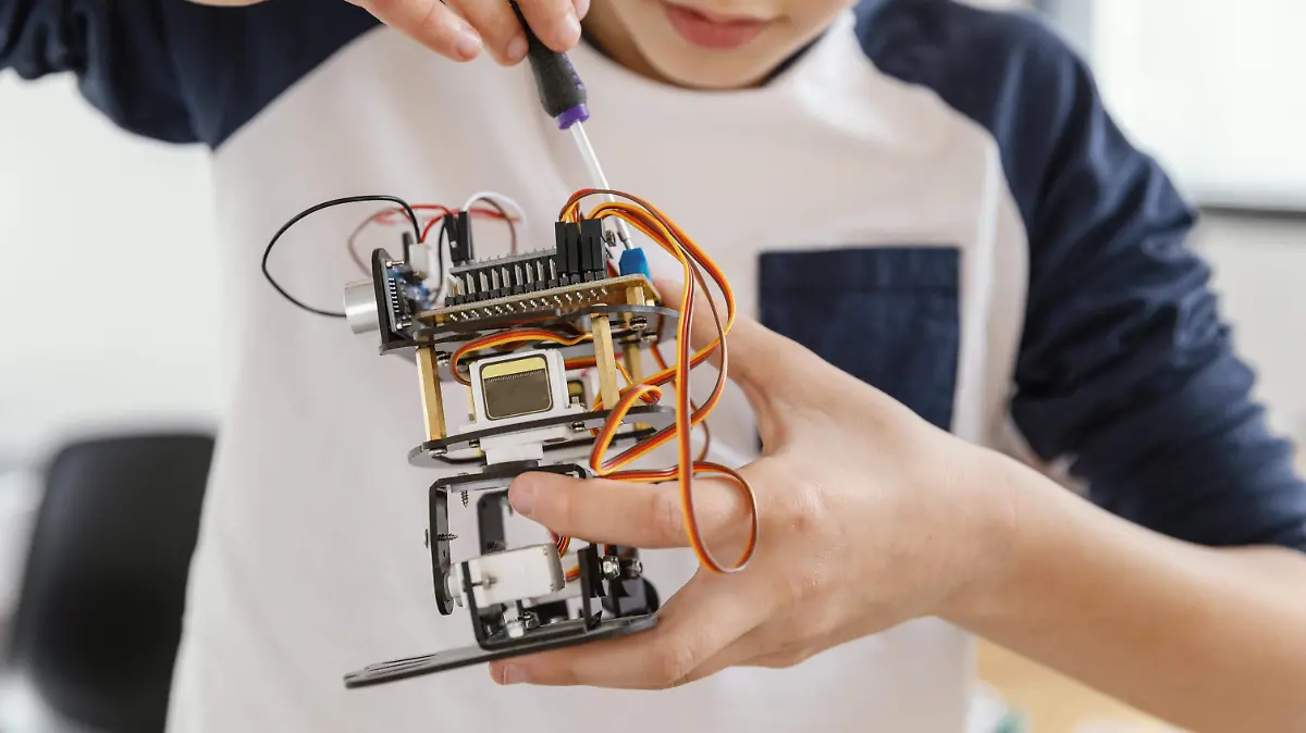 close-up-child-making-robots