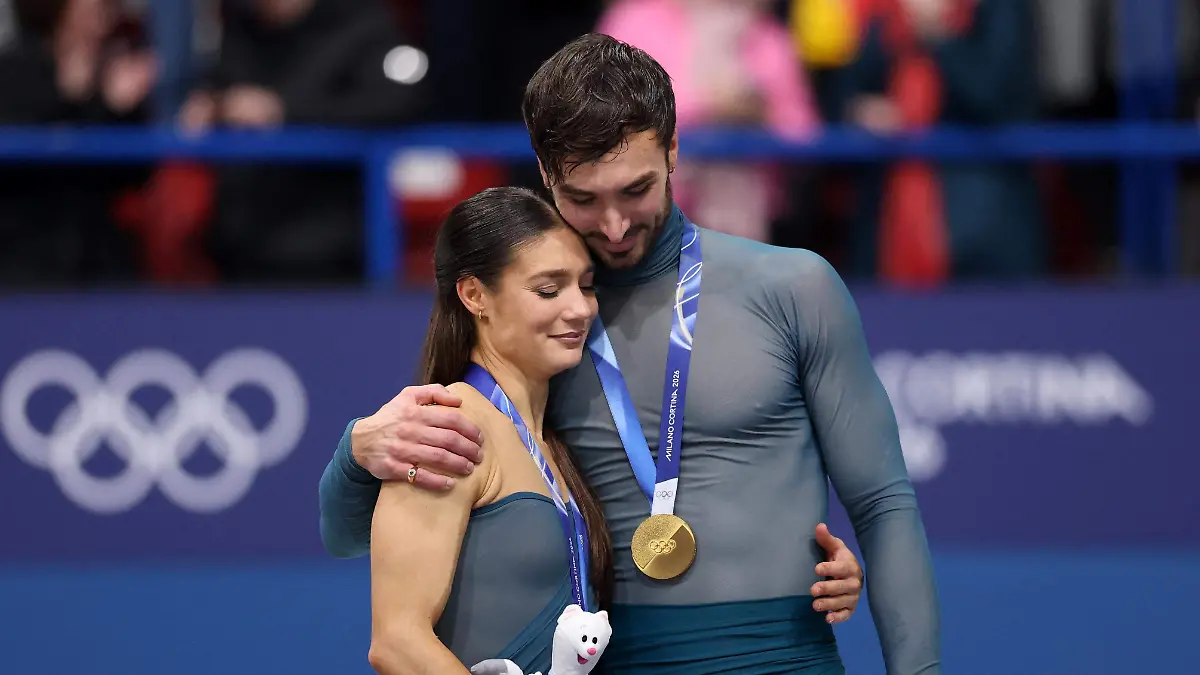 2026-02-11T223549Z_415597033_UP1EM2B1QRNHD_RTRMADP_3_OLYMPICS-2026-FIGURESKATING