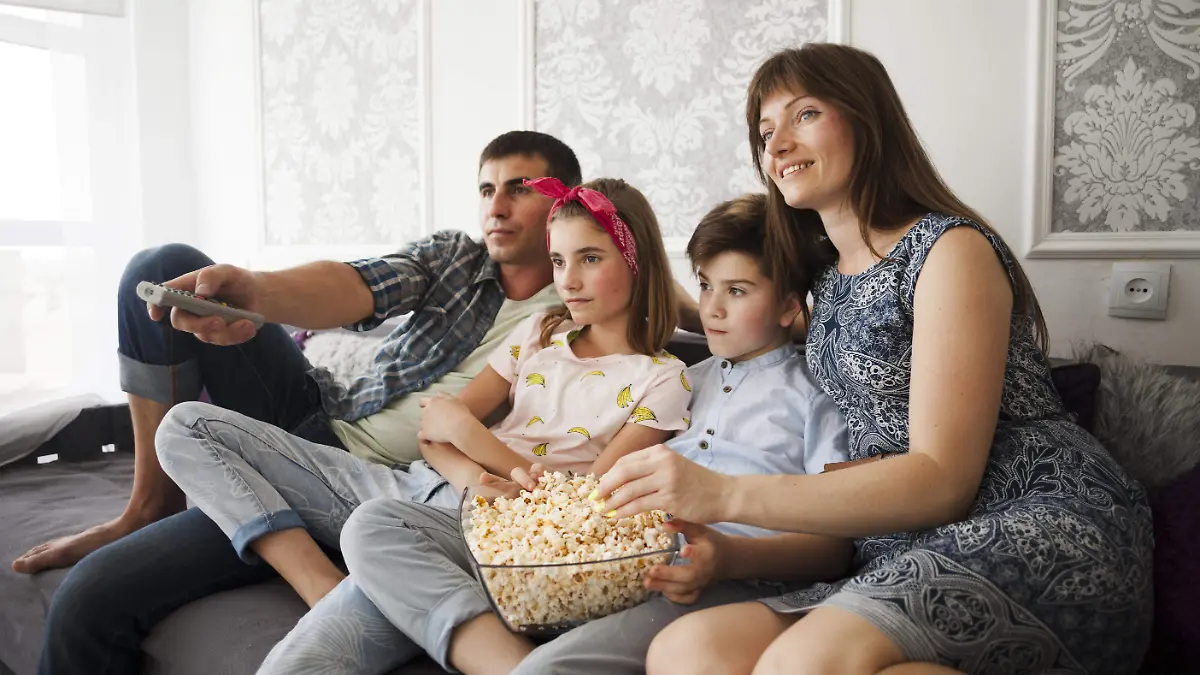 family-eating-popcorn-watching-television-home