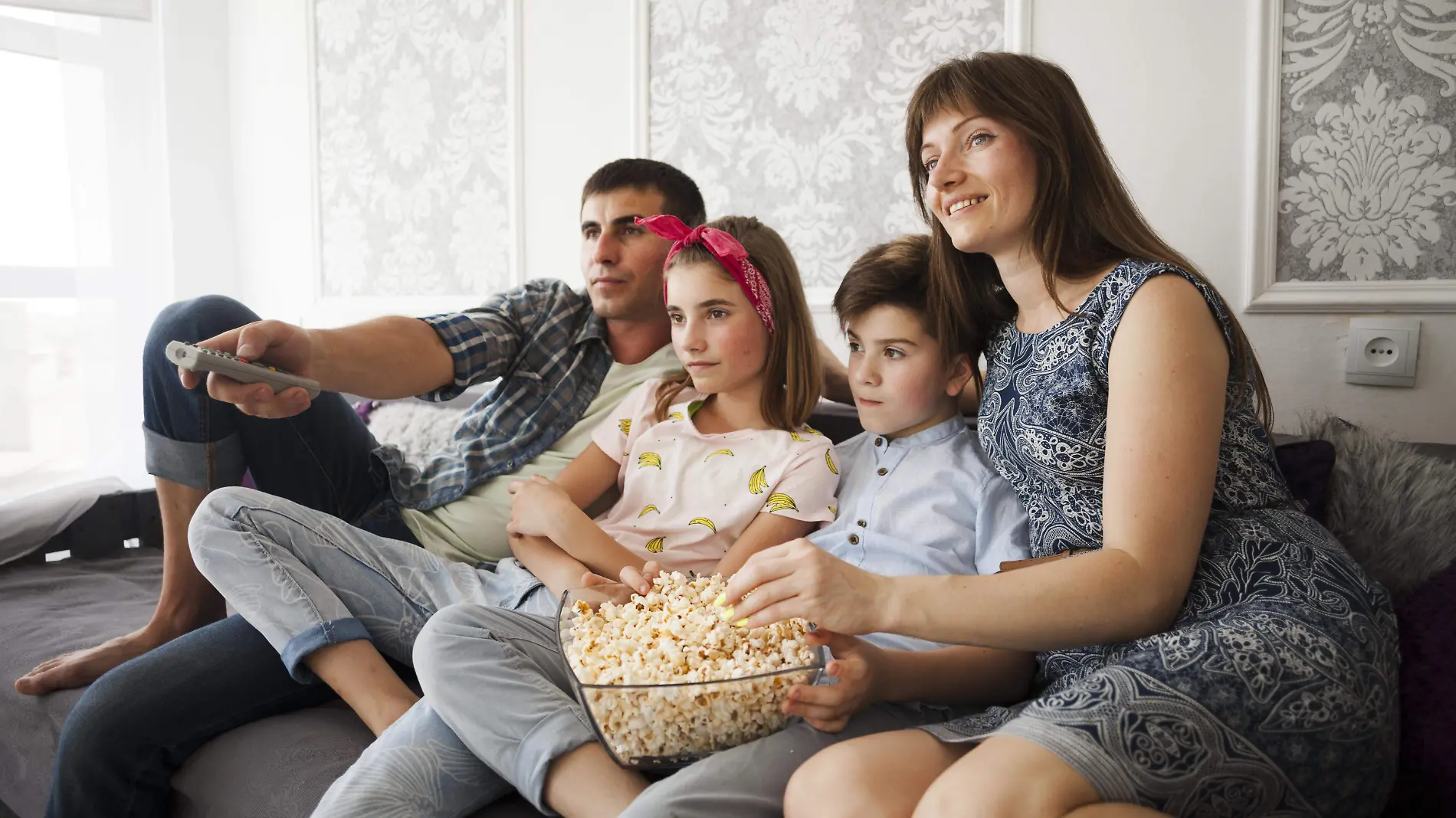 family-eating-popcorn-watching-television-home