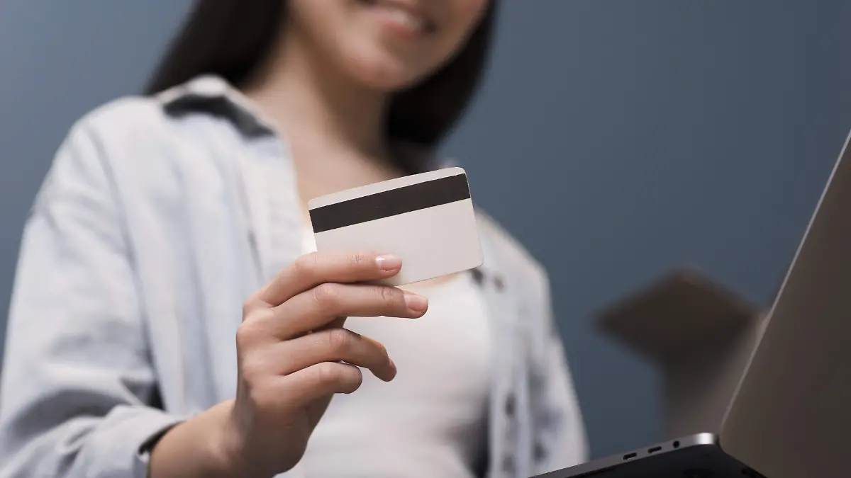 low-angle-of-woman-ordering-online-using-credit-card