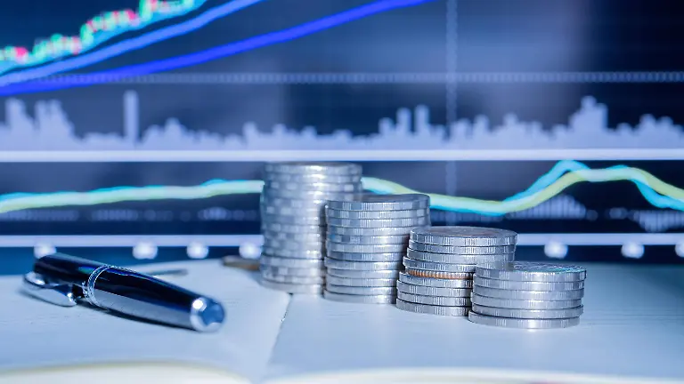 stack-of-money-coin-with-trading-graph