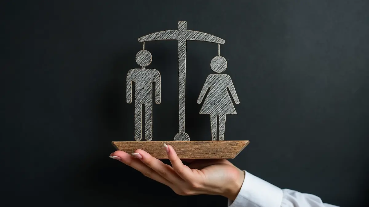 the_image_shows_a_blackboard_with_a_scale_balancing_a_male_and_female_figure_symbolizing_gender_equ_angzyr17h9idku0voaug_3